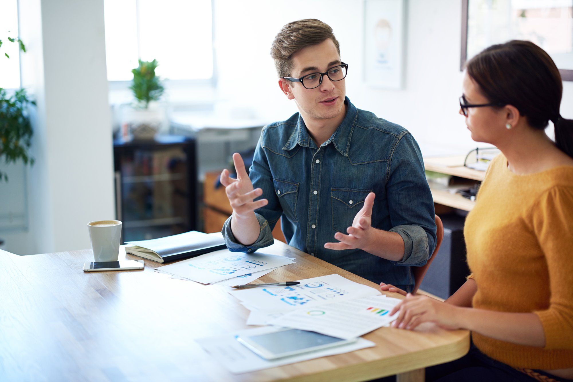 Man and woman working at office desk